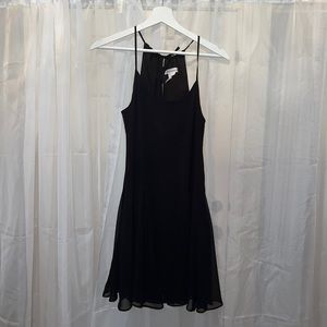 Black BCBG dress, ties at the neck and flows at the waist